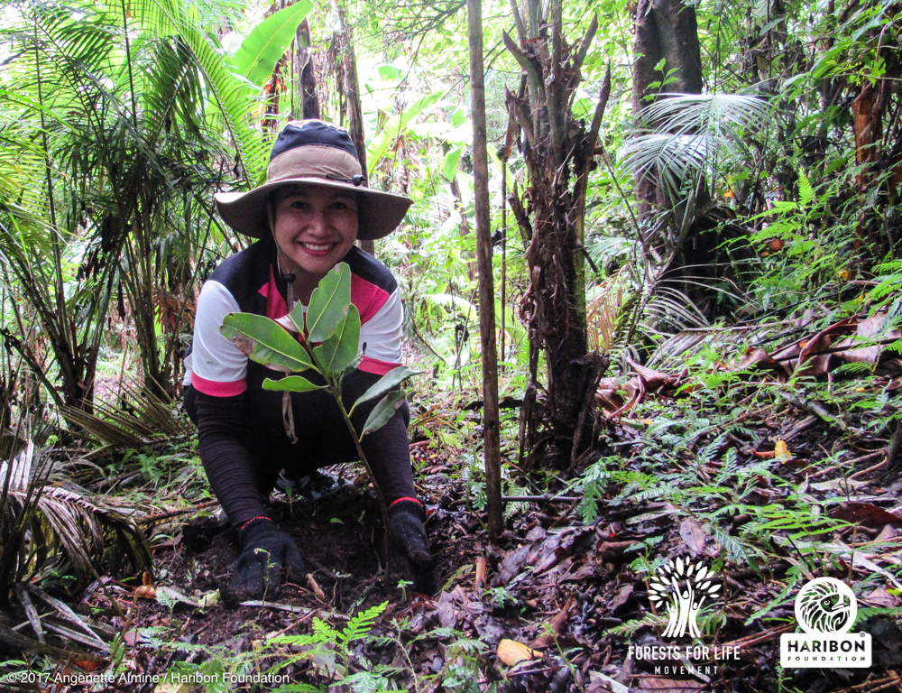 Tree planting volunteer by Angenette Almine
